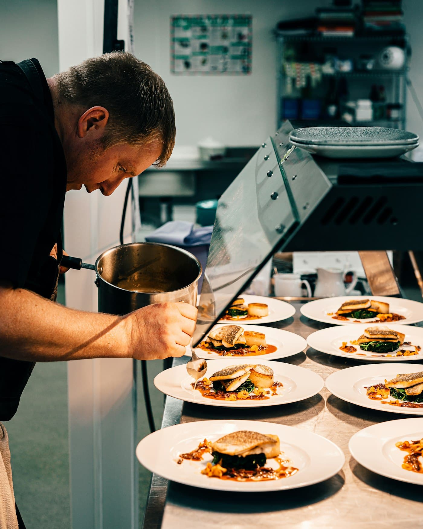 Hygienic chicken preparation inside a clean stainless-steel kitchen environment
